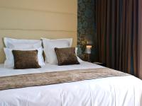 a large white bed with two pillows on it at Lutecia Smart Design Hotel in Lisbon
