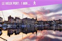 a poster of a harbor with boats in the water at Le Studio du Gouverneur in Honfleur