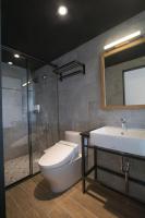 a bathroom with a toilet and a sink and a shower at NK Hostel in Taipei