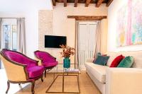 A television and/or entertainment centre at Genteel Home Feria