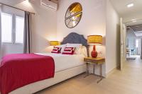 A bed or beds in a room at Genteel Home Feria