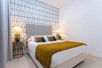 A bed or beds in a room at Genteel Home Feria