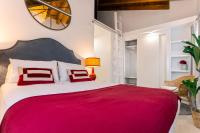 A bed or beds in a room at Genteel Home Feria