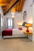 A bed or beds in a room at Genteel Home Feria