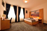 Postel nebo postele na pokoji v ubytování Hotel Orient Zagreb