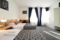 Postel nebo postele na pokoji v ubytování Hotel Orient Zagreb