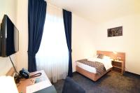 Postel nebo postele na pokoji v ubytování Hotel Orient Zagreb