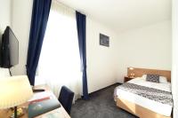 Postel nebo postele na pokoji v ubytování Hotel Orient Zagreb