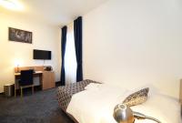 Postel nebo postele na pokoji v ubytování Hotel Orient Zagreb