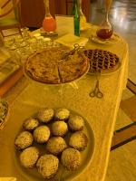 a table with a plate of muffins and a pizza at Savant Hotel in Lamezia Terme