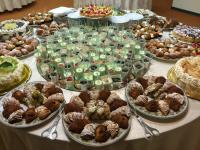 a table with many different types of pastries on it at Savant Hotel in Lamezia Terme