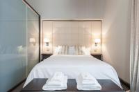 A bed or beds in a room at Milan Royal Suites - Centro Cadorna