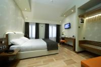 A bed or beds in a room at Hotel Forte del 48