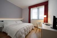 A bed or beds in a room at Hotel Forte del 48