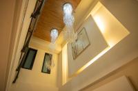 a hallway with two chandeliers hanging from the ceiling at 日月潭天月水色民宿 (老街-停車-度假）skylight bnb in Yuchi