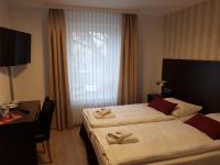 Postel nebo postele na pokoji v ubytování Hotel und Restaurant Rosenkranz