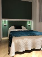 A bed or beds in a room at Hostal León