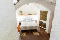 A bed or beds in a room at Apartamentos Montesclaros