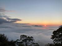 a view of the sun rising above a sea of clouds at Cingjing Brilliant Twins of Seattle in Ren&#39;ai