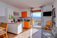 A kitchen or kitchenette at La Portella - Gardagate