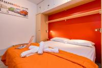 A bed or beds in a room at La Portella - Gardagate