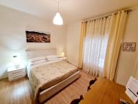 A bed or beds in a room at Nel Sole monolocale