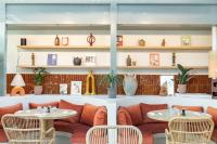 a restaurant with tables and chairs and shelves at Domaine Gao in Aix-en-Provence