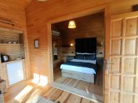 Postel nebo postele na pokoji v ubytování Lycia Nature House