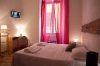 A bed or beds in a room at Albergo delle Spezie