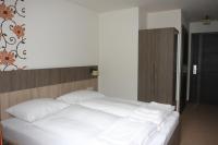 Łóżko lub łóżka w pokoju w obiekcie Hotel Alta Vista