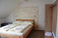 Postel nebo postele na pokoji v ubytování Penzion Sedlecká vína