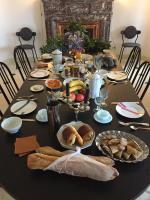 a black table with food and bread on it at Au Petit Thouars in Thouars