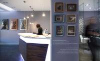a exhibit in a museum with a woman sitting at a counter at Salamanca Suite Studios in Salamanca