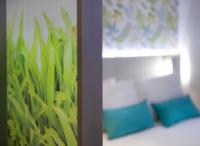 a room with two blue pillows and a window at Salamanca Suite Studios in Salamanca