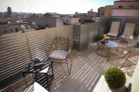 a balcony with chairs and a table and a fence at Salamanca Suite Studios in Salamanca