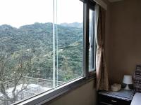 a window with a view of a mountain at Levite Villa in Jiufen