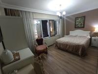 A bed or beds in a room at Asmali Hotel