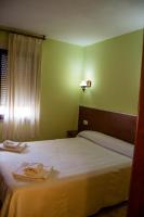 Postel nebo postele na pokoji v ubytování El Roble Hotel Restaurante