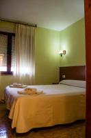 Postel nebo postele na pokoji v ubytování El Roble Hotel Restaurante