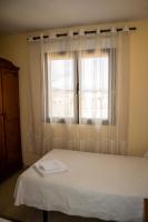 Postel nebo postele na pokoji v ubytování El Roble Hotel Restaurante