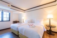 Postel nebo postele na pokoji v ubytování MORA Boutique Hotel - SHA Extra Plus