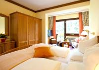 Postel nebo postele na pokoji v ubytování Wohlfühl & Genusshotel Felsenhof