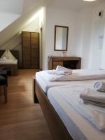 Łóżko lub łóżka w pokoju w obiekcie Hotel Familia