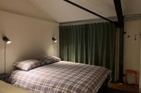 Postel nebo postele na pokoji v ubytování Karibu de Stallen (met Sauna en Stoom douche)