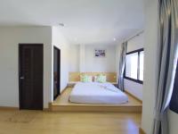 Postel nebo postele na pokoji v ubytování Klongrien Boutique Hotel