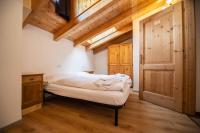 Posteľ alebo postele v izbe v ubytovaní Alpino Lodge Bivio