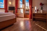 Posteľ alebo postele v izbe v ubytovaní Alpino Lodge Bivio