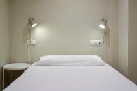Postel nebo postele na pokoji v ubytování Pamplonapartments Duque de Ahumada