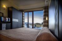 A bed or beds in a room at Hotel Ristorante San Carlo
