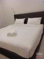 Postel nebo postele na pokoji v ubytování Suwannolhotel